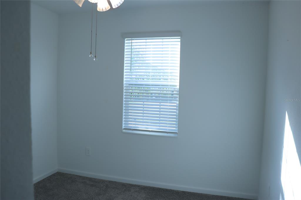 34558 Shellback Street Leesburg, FL 34788 - Photo 27 of 36 an empty room with a window