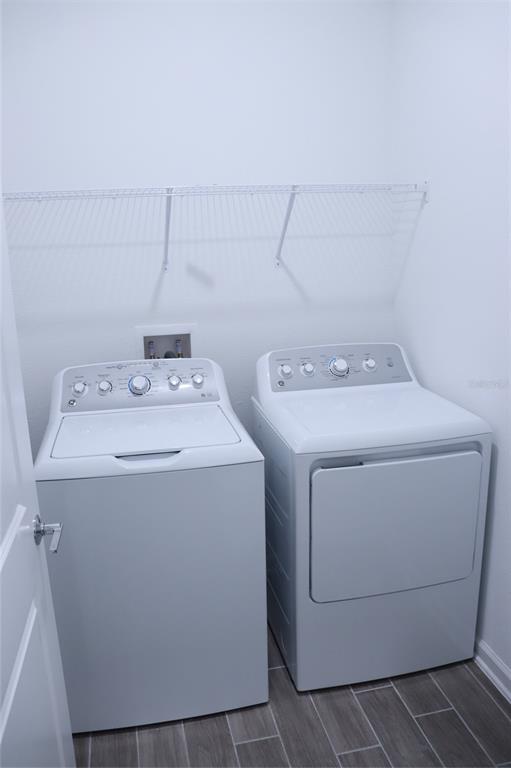 34558 Shellback Street Leesburg, FL 34788 - Photo 34 of 36 a utility room with dryer and washer