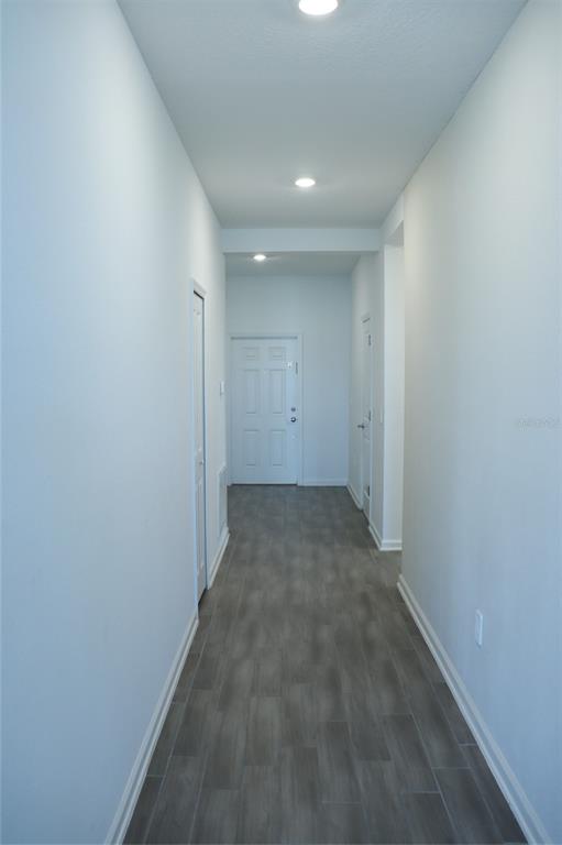 34558 Shellback Street Leesburg, FL 34788 - Photo 35 of 36 a view of a big room with wooden floor