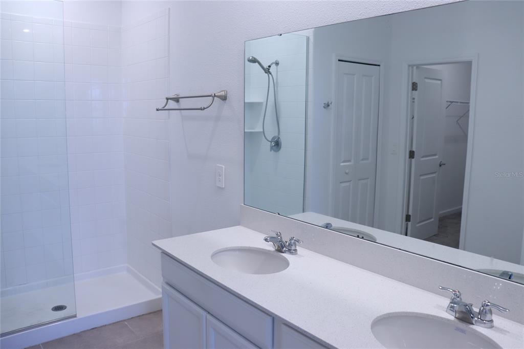 34558 Shellback Street Leesburg, FL 34788 - Photo 5 of 36 a bathroom with a sink and a mirror