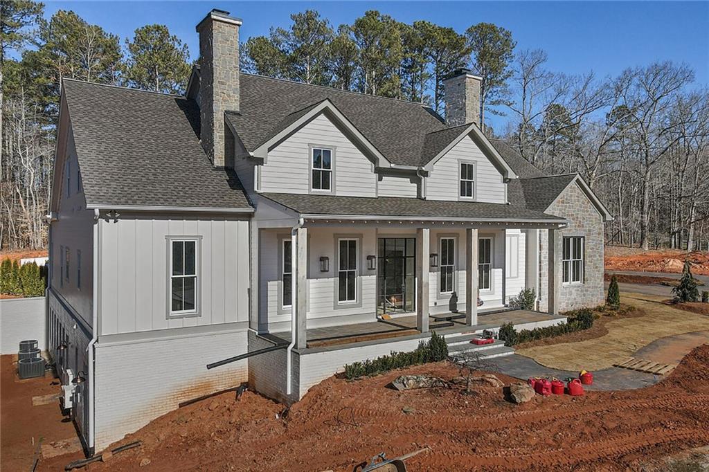 14540 Thompson Road Milton, GA 30004 - Photo 1 of 1 a front view of a house with a yard