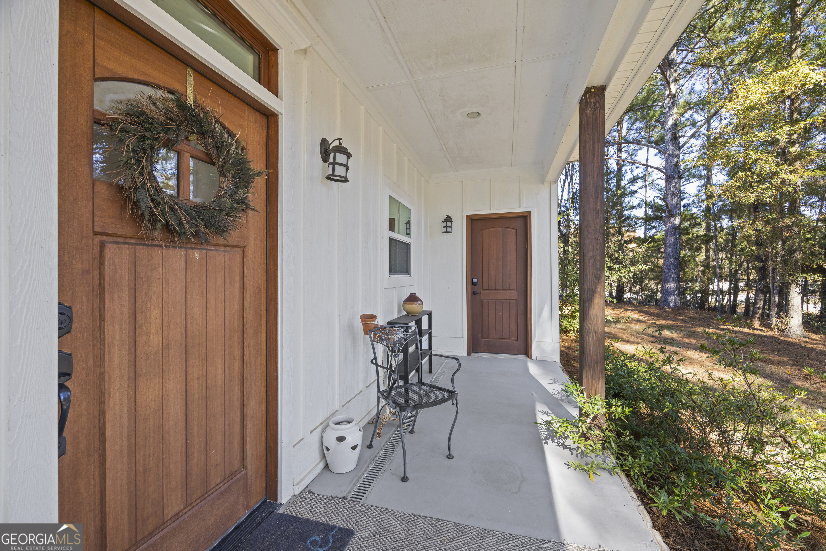 32 Shirleys Way Hartwell, GA 30643 - Photo 12 of 42 a view of a porch with chairs and potted plants