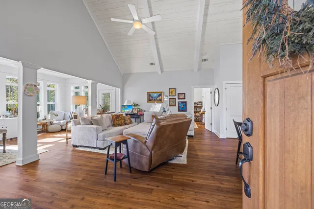 a bed room with couch and window