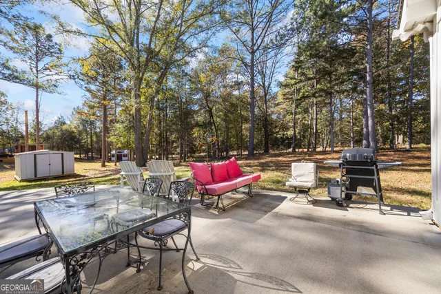 a living room with furniture a fireplace and wooden floor