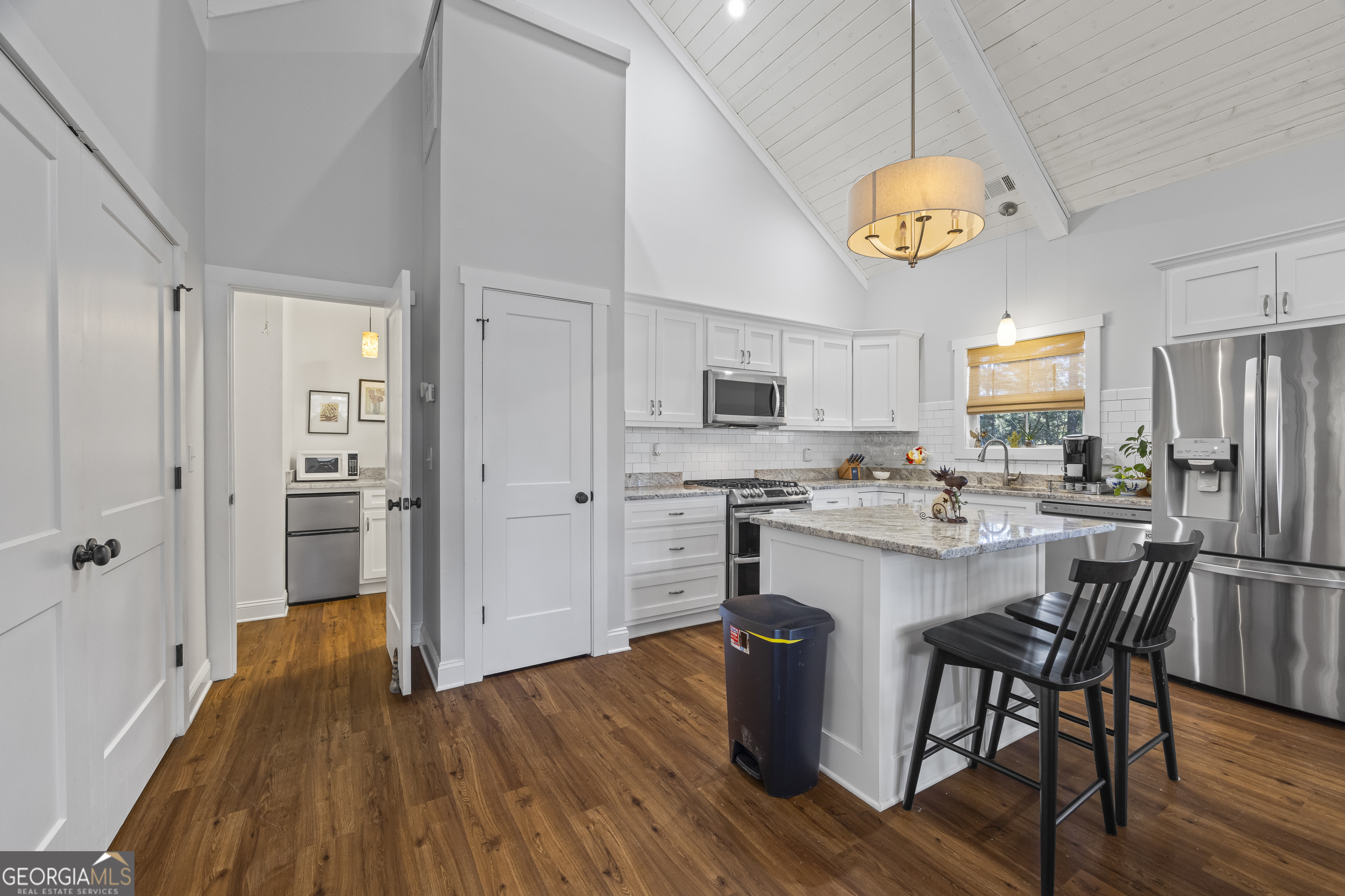 32 Shirleys Way Hartwell, GA 30643 - Photo 22 of 42 a kitchen with a refrigerator and white cabinets