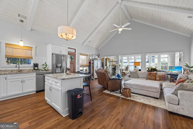a bathroom with a sink and a refrigerator