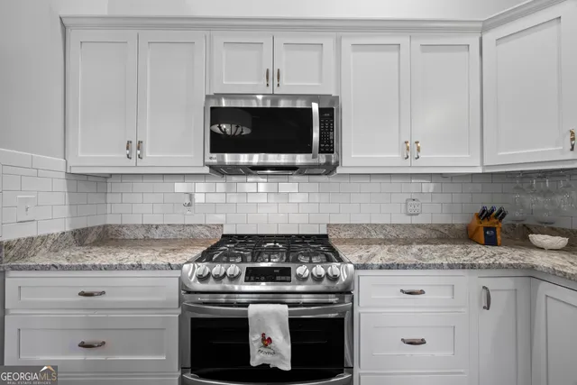 a bedroom with a bed couch and window