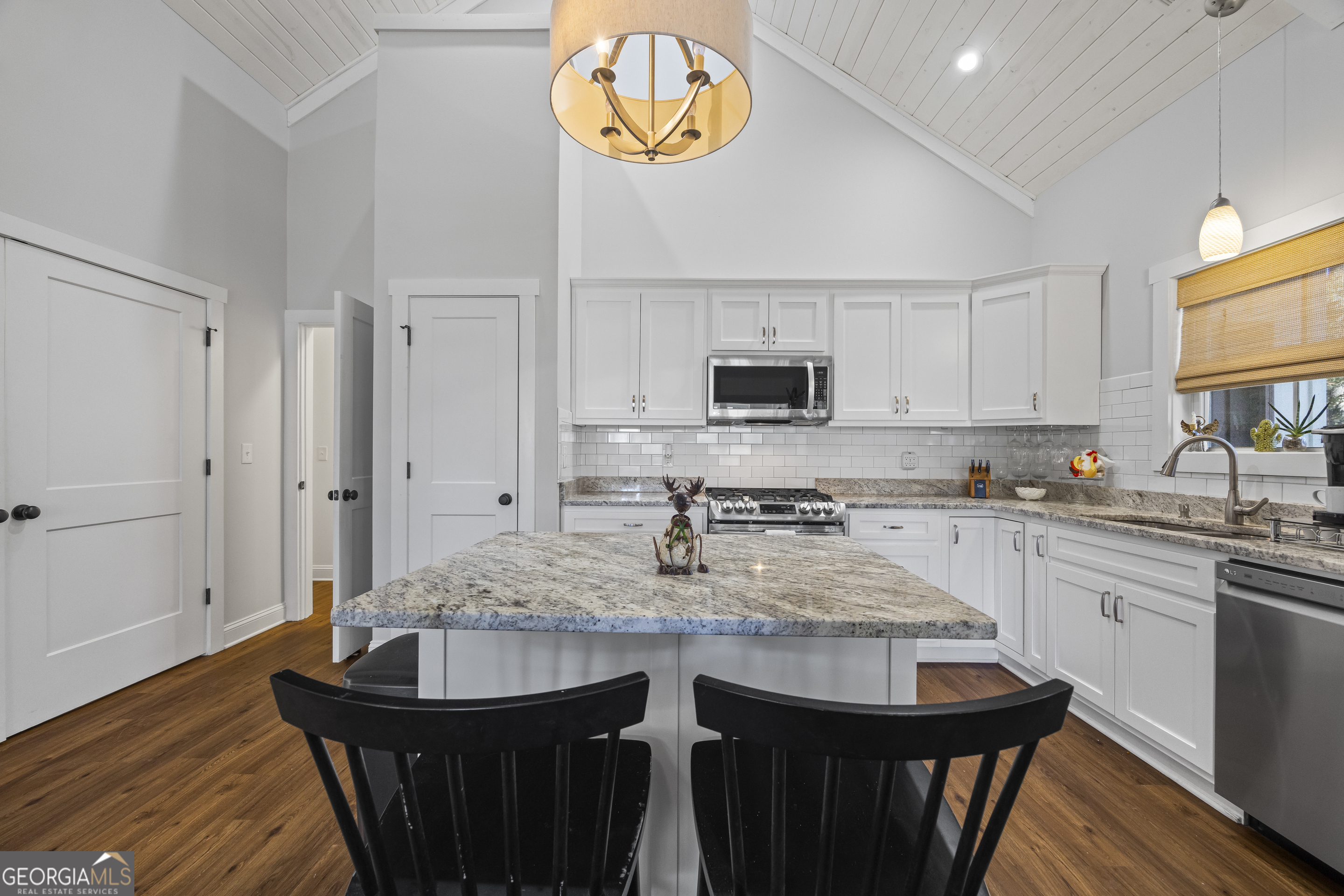 32 Shirleys Way Hartwell, GA 30643 - Photo 25 of 42 a kitchen with stainless steel appliances granite countertop a stove a sink dishwasher and microwave with wooden floor