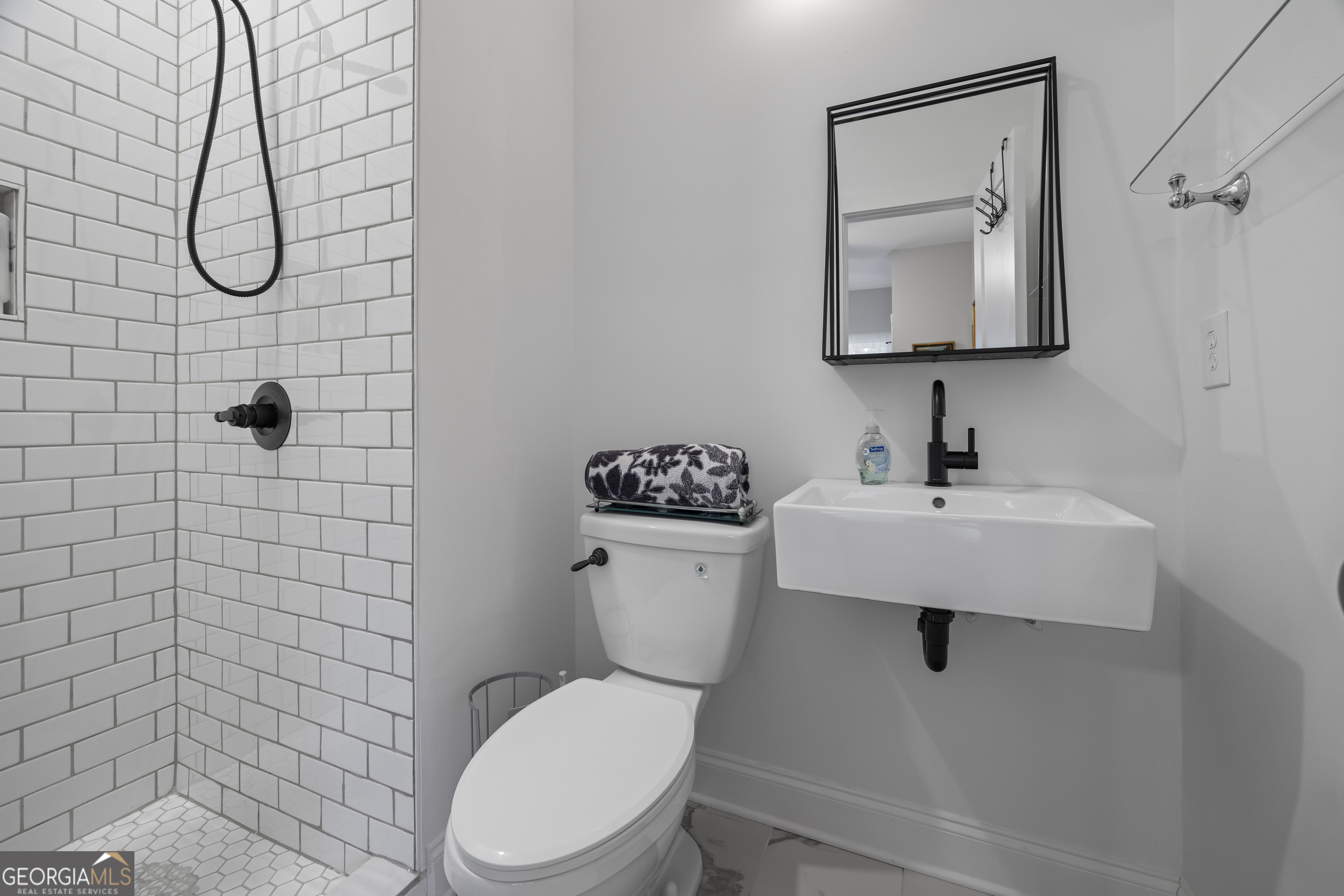 32 Shirleys Way Hartwell, GA 30643 - Photo 28 of 42 a bathroom with a toilet sink and mirror