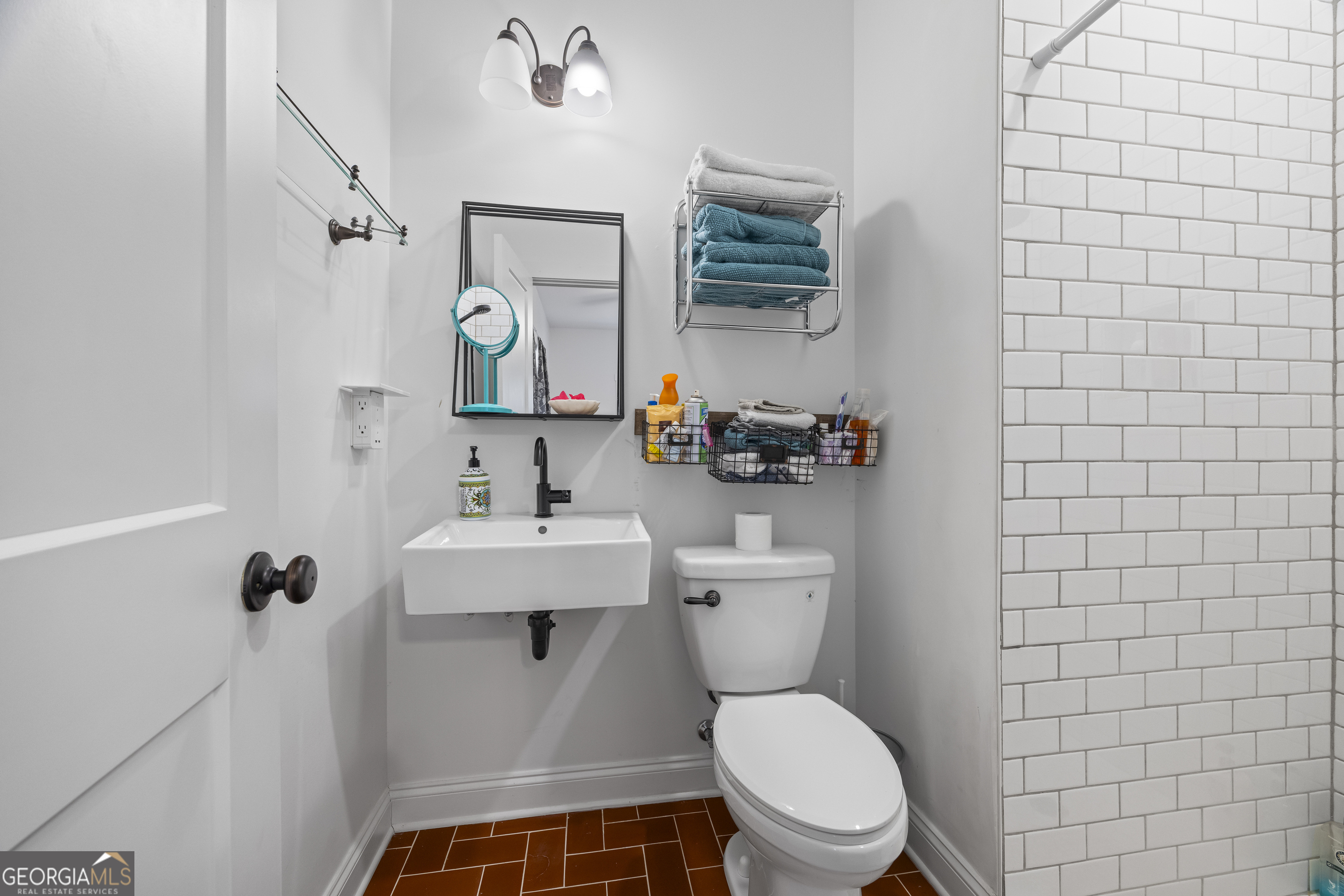 32 Shirleys Way Hartwell, GA 30643 - Photo 30 of 42 a bathroom with a toilet a sink and mirror