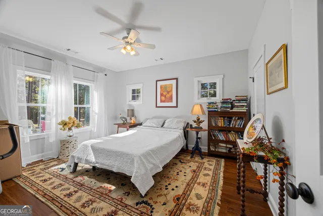 a bathroom with a granite countertop double vanity sinks and a mirror