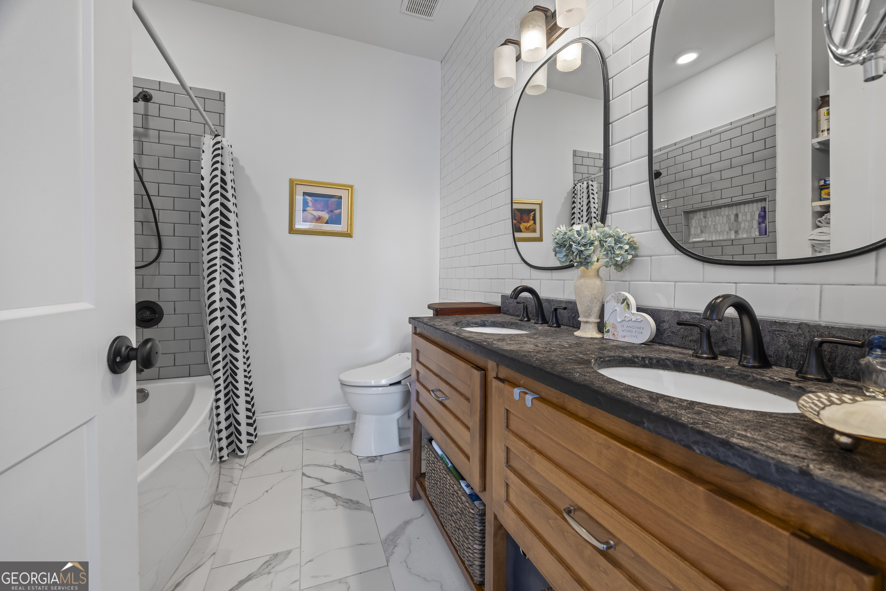 32 Shirleys Way Hartwell, GA 30643 - Photo 32 of 42 a bathroom with a sink a toilet and a mirror