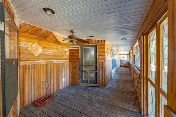 a living room with a flat screen tv and a rug