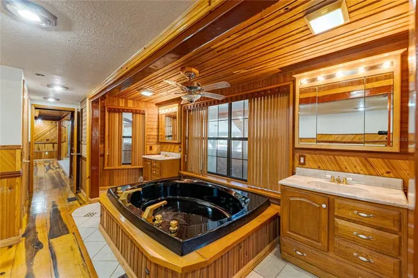 a view of a kitchen with furniture and a refrigerator