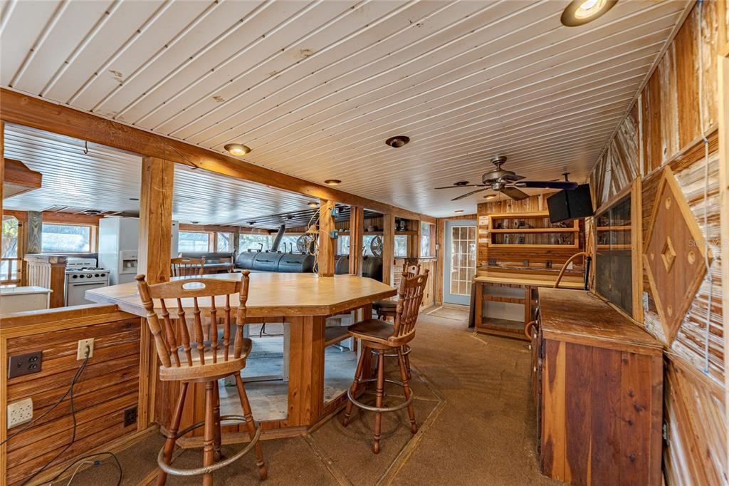 11053 Mulberry Landing Road North Hilliard, FL 32046 - Photo 40 of 100 a dining room with furniture and a floor to ceiling window