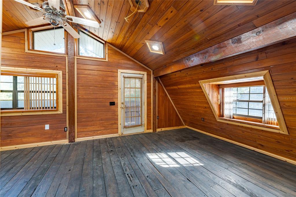 11053 Mulberry Landing Road North Hilliard, FL 32046 - Photo 52 of 100 an empty room with wooden floor and windows