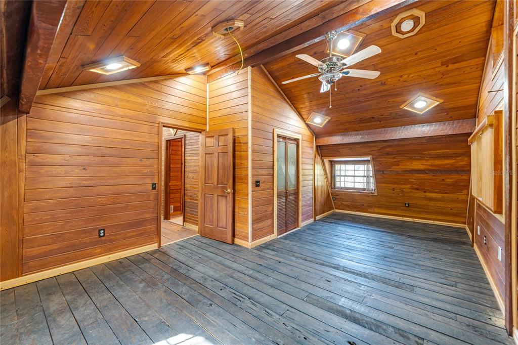 11053 Mulberry Landing Road North Hilliard, FL 32046 - Photo 53 of 100 a view of an empty room with wooden floor and a window