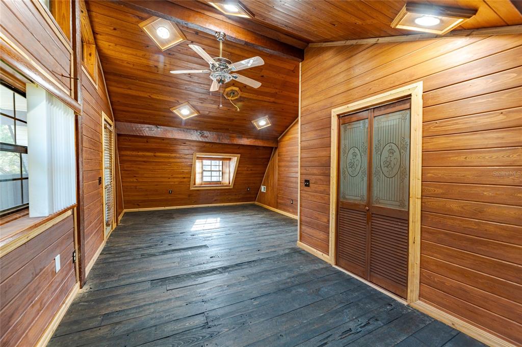 11053 Mulberry Landing Road North Hilliard, FL 32046 - Photo 54 of 100 a view of a hallway with wooden floor and staircase