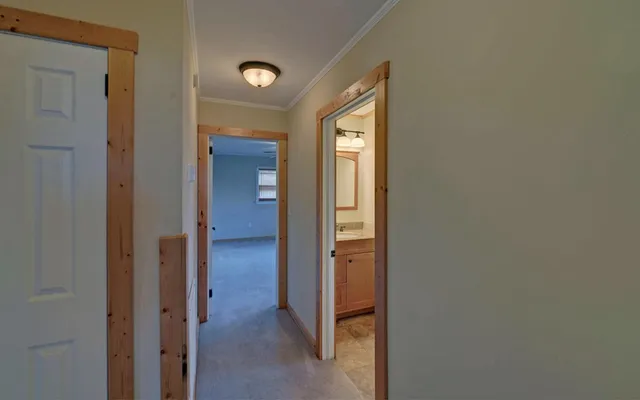 a view of a bathroom from a hallway