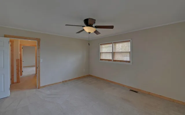 a view of room with ceiling fan