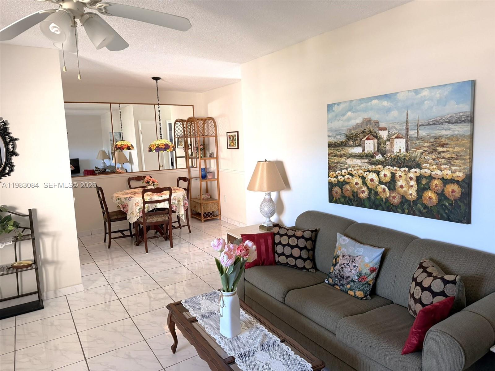 17000 Northeast 14th Avenue, Unit 206 Miami, FL 33162 - Photo 1 of 15 a living room with furniture and wooden floor