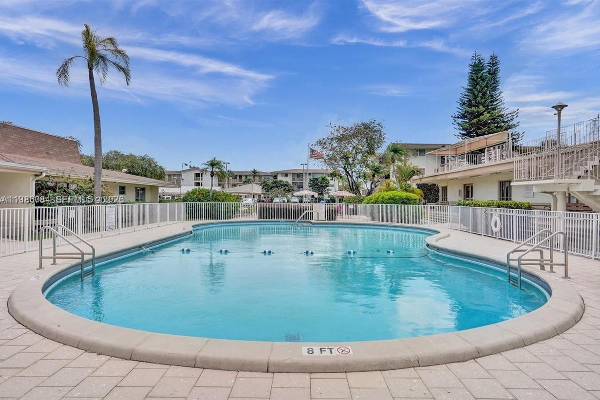 17000 Northeast 14th Avenue, Unit 206 Miami, FL 33162 - Photo 14 of 15 a view of a swimming pool