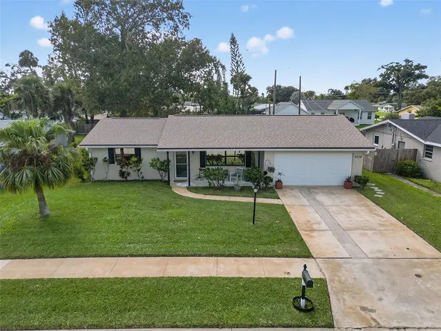 a aerial view of a house with a yard