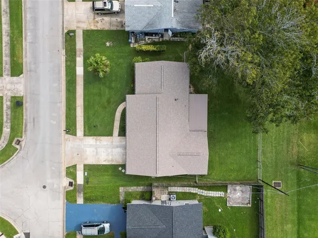 an aerial view of a house with a garden