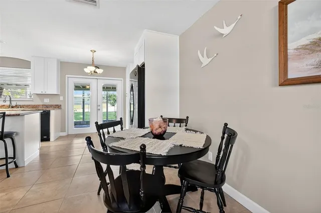 a view of a dining room with furniture and window