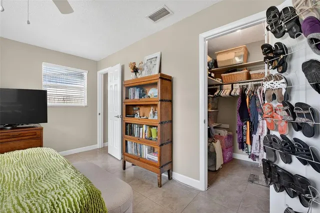 a view of a livingroom with workspace and windows