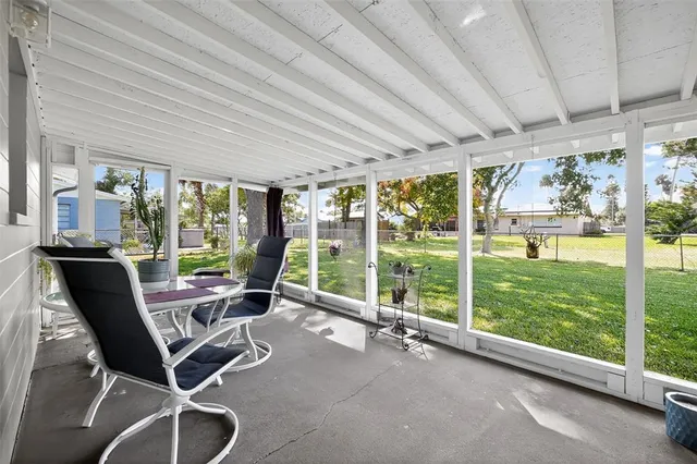 a work room with chairs and floor to ceiling window