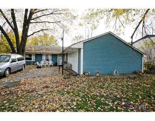 413 Rockhurst Road Bolingbrook, IL 60440 - Photo 1 of 1 a backyard of a house with lots of green space