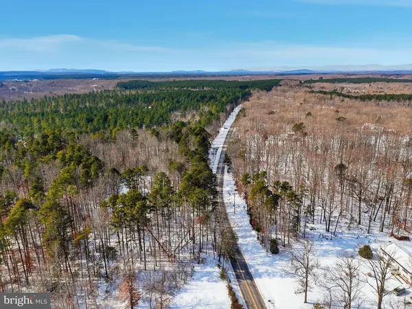 a view of a yard next to a lake view