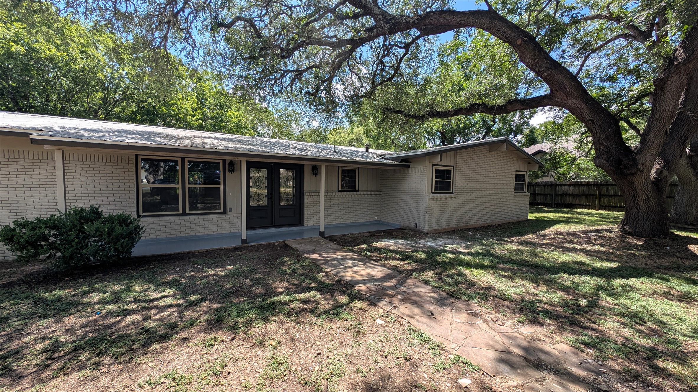11811 Sleepy Hollow Road Manchaca, TX 78652 - Photo 1 of 31 a house view with a garden space