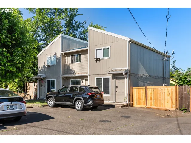 a view of a car park in front of house