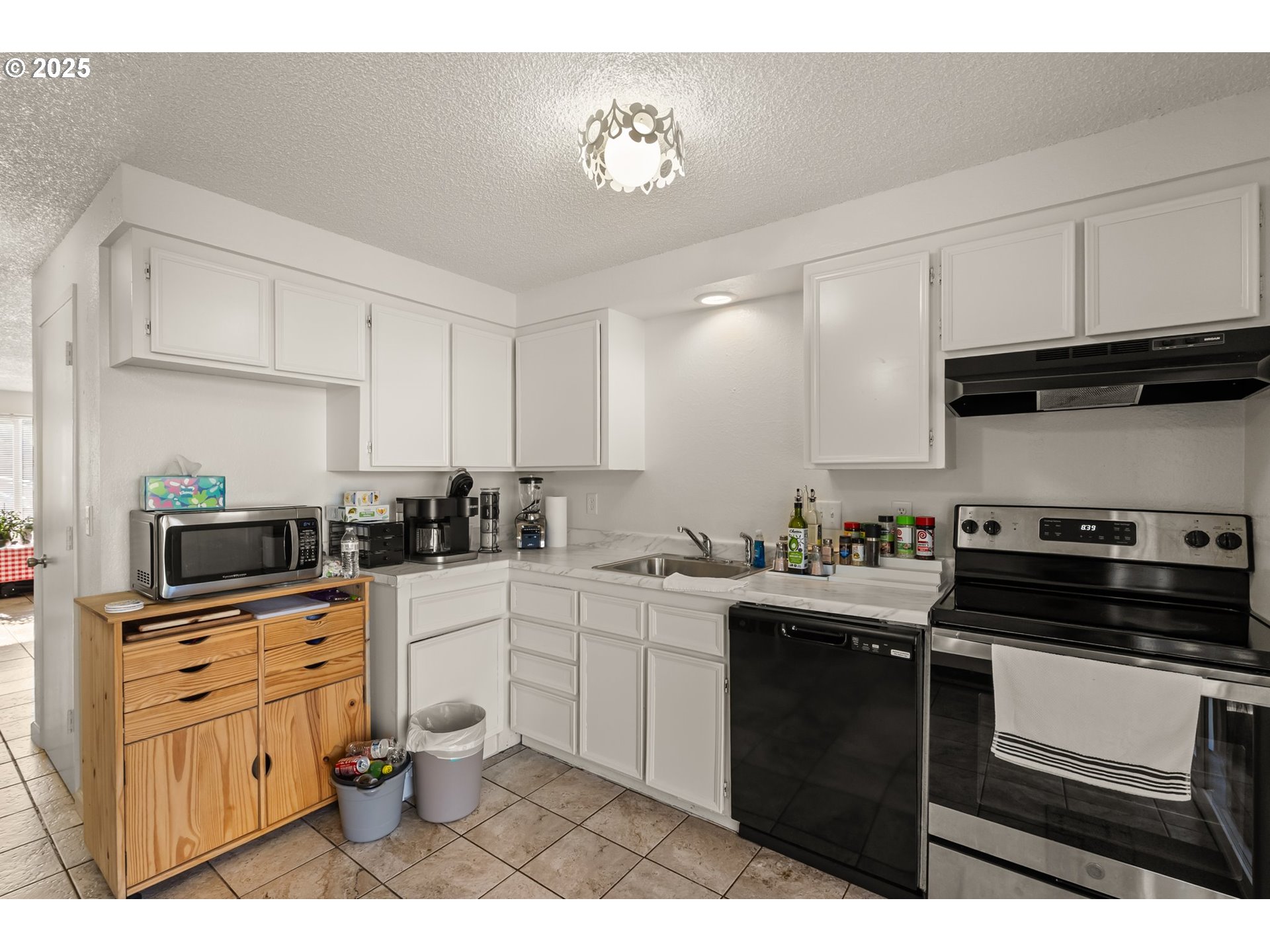 1720 17th Street Springfield, OR 97477 - Photo 11 of 23 a kitchen with a sink stove and cabinets