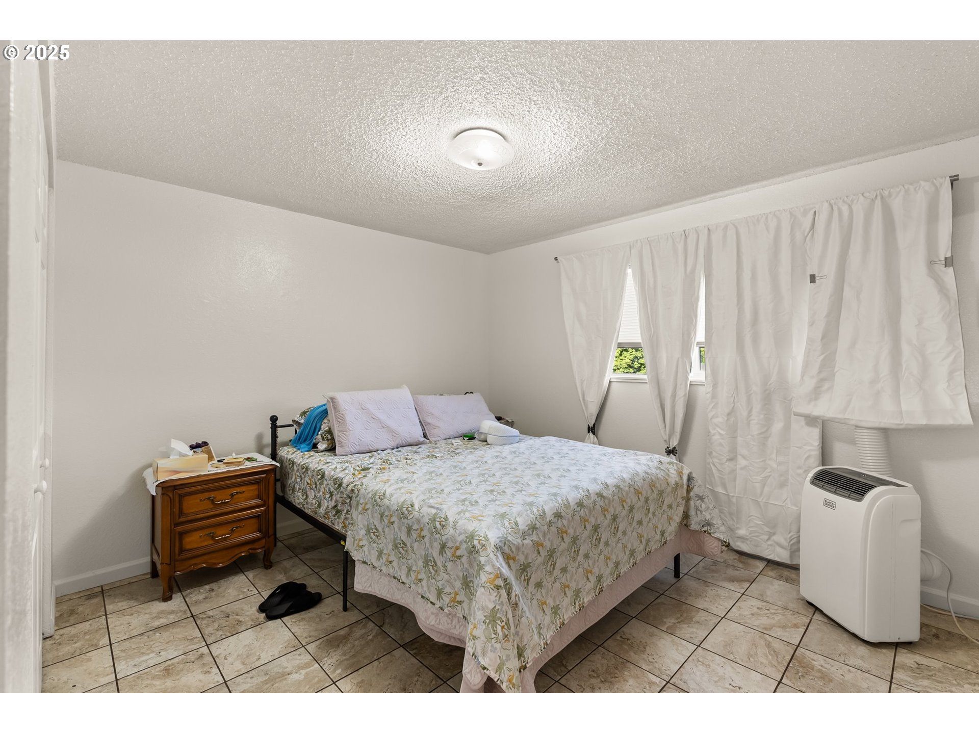 1720 17th Street Springfield, OR 97477 - Photo 18 of 23 a bedroom with a bed and a view of bathroom