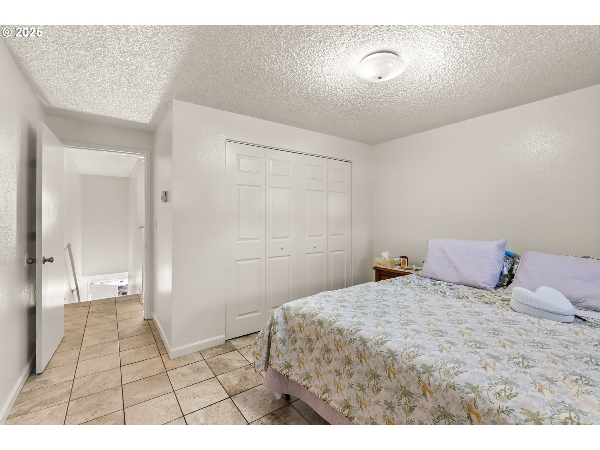 1720 17th Street Springfield, OR 97477 - Photo 19 of 23 a bedroom with a bed and a shower