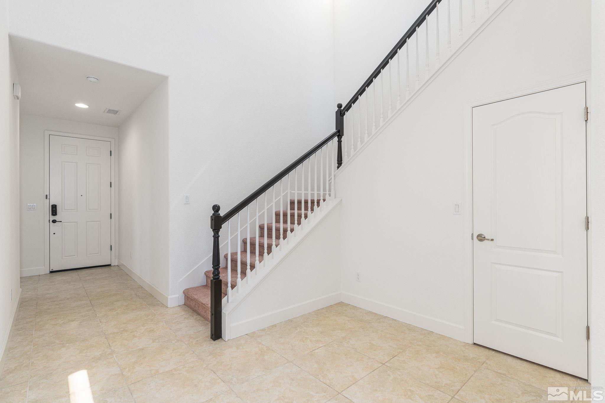 10729 Ridgebrook Drive Reno, NV 89521 - Photo 13 of 26 a view of an entryway with staircase