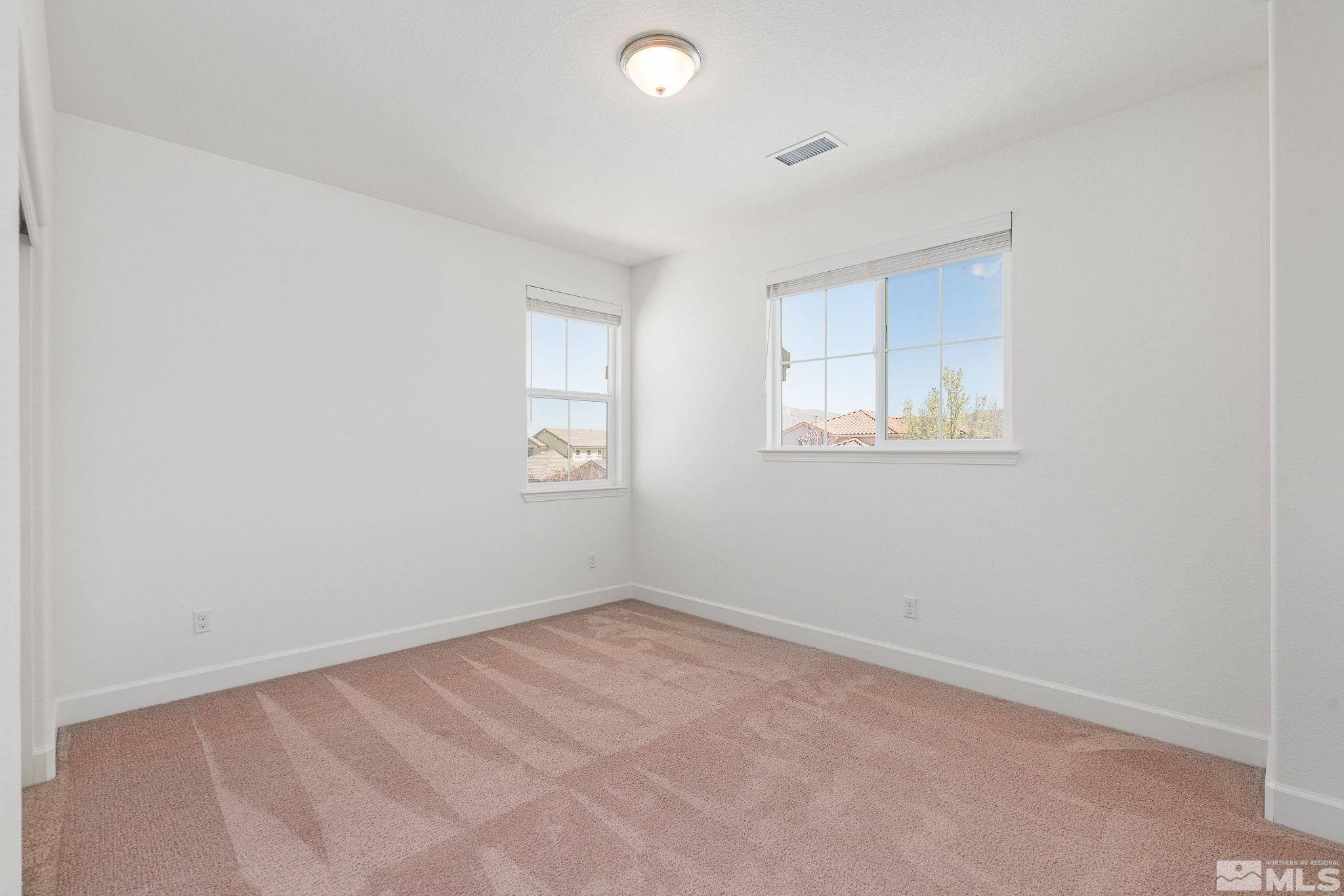 10729 Ridgebrook Drive Reno, NV 89521 - Photo 19 of 26 an empty room with a window