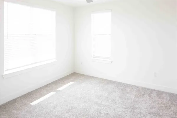 a view of a small space with wooden floor