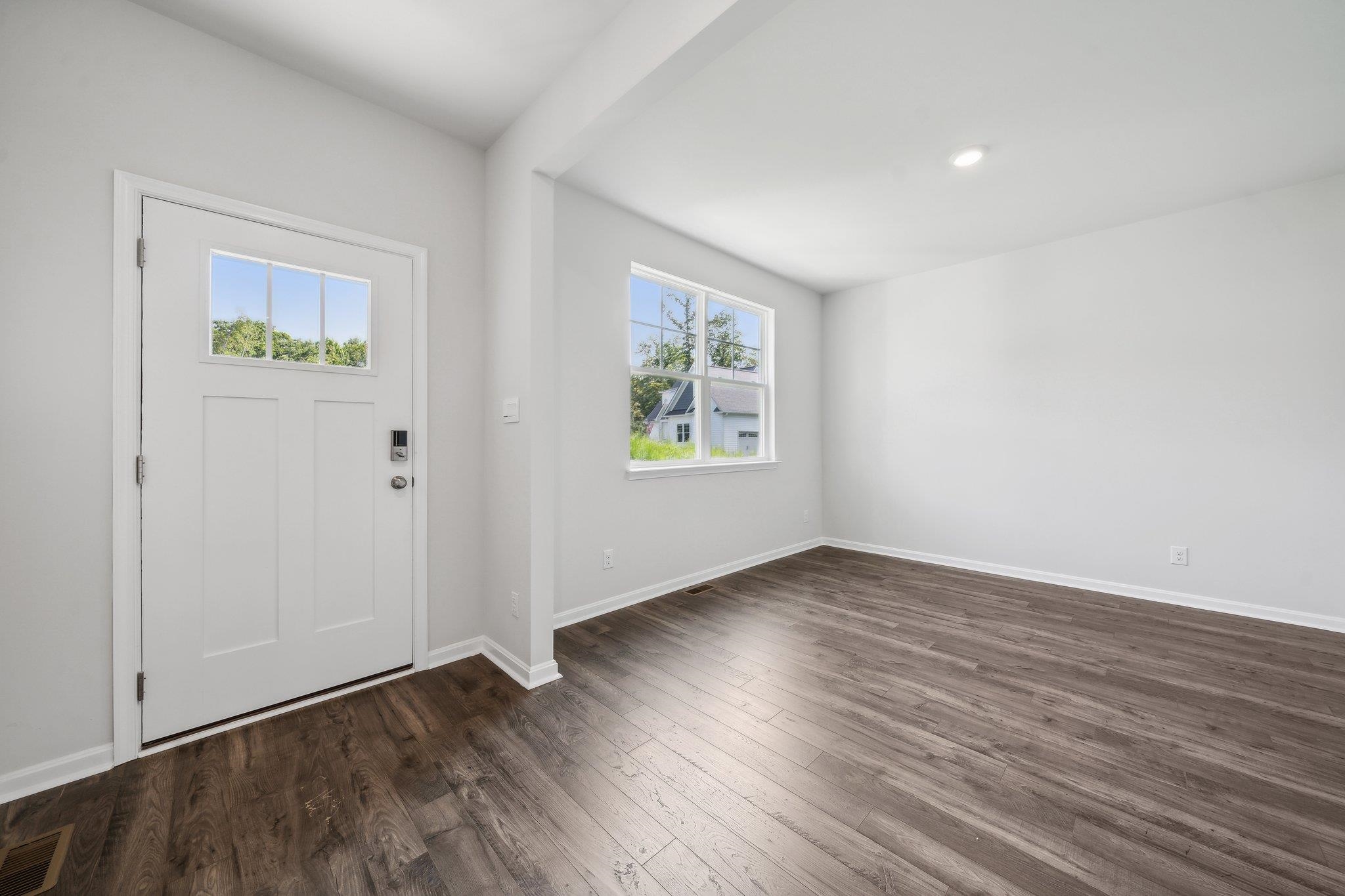 240 Waterfront Drive Raphine, VA 24472 - Photo 15 of 29 an empty room with wooden floor & windows