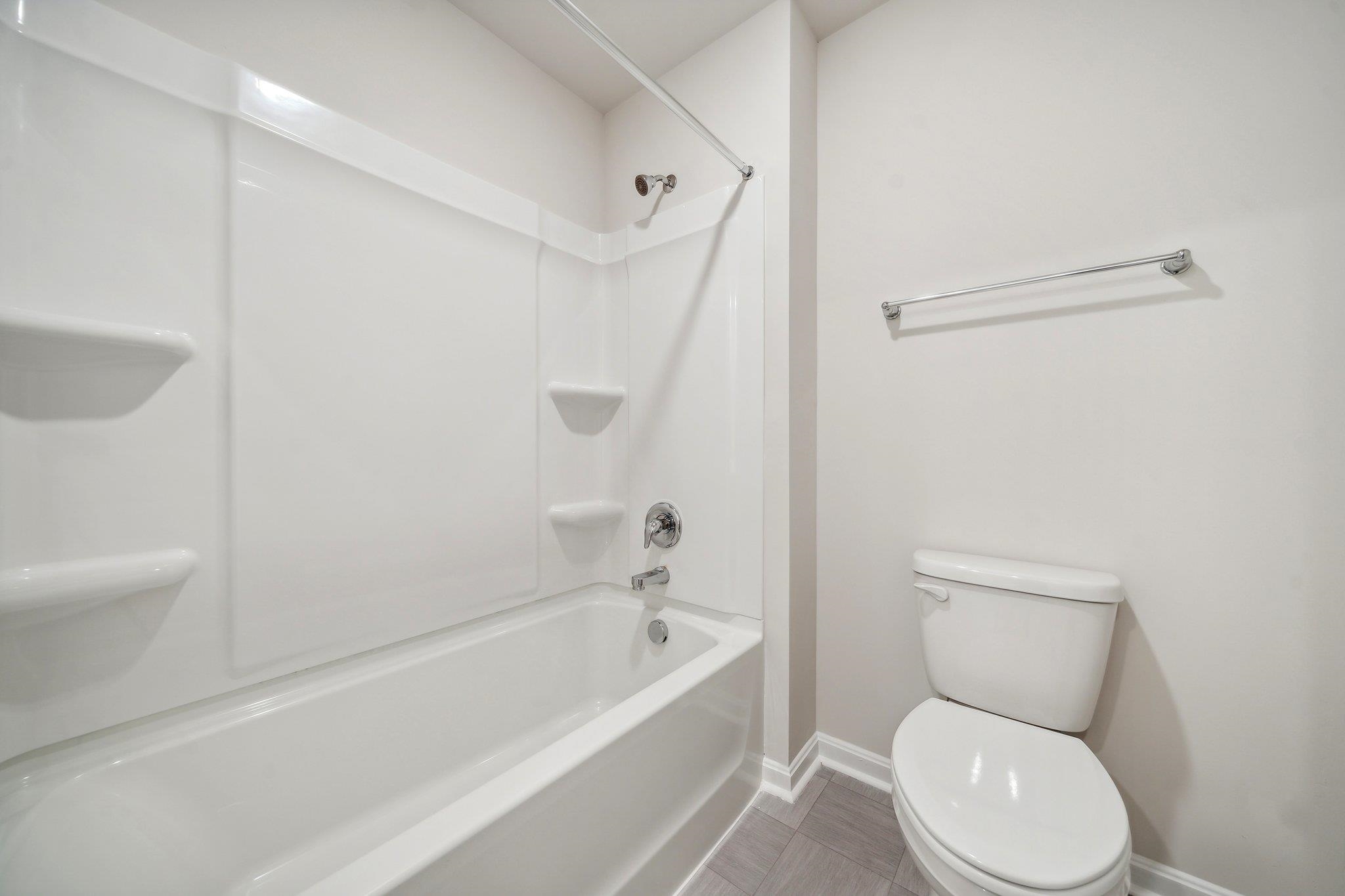 240 Waterfront Drive Raphine, VA 24472 - Photo 27 of 29 a white toilet sitting next to a bath tub