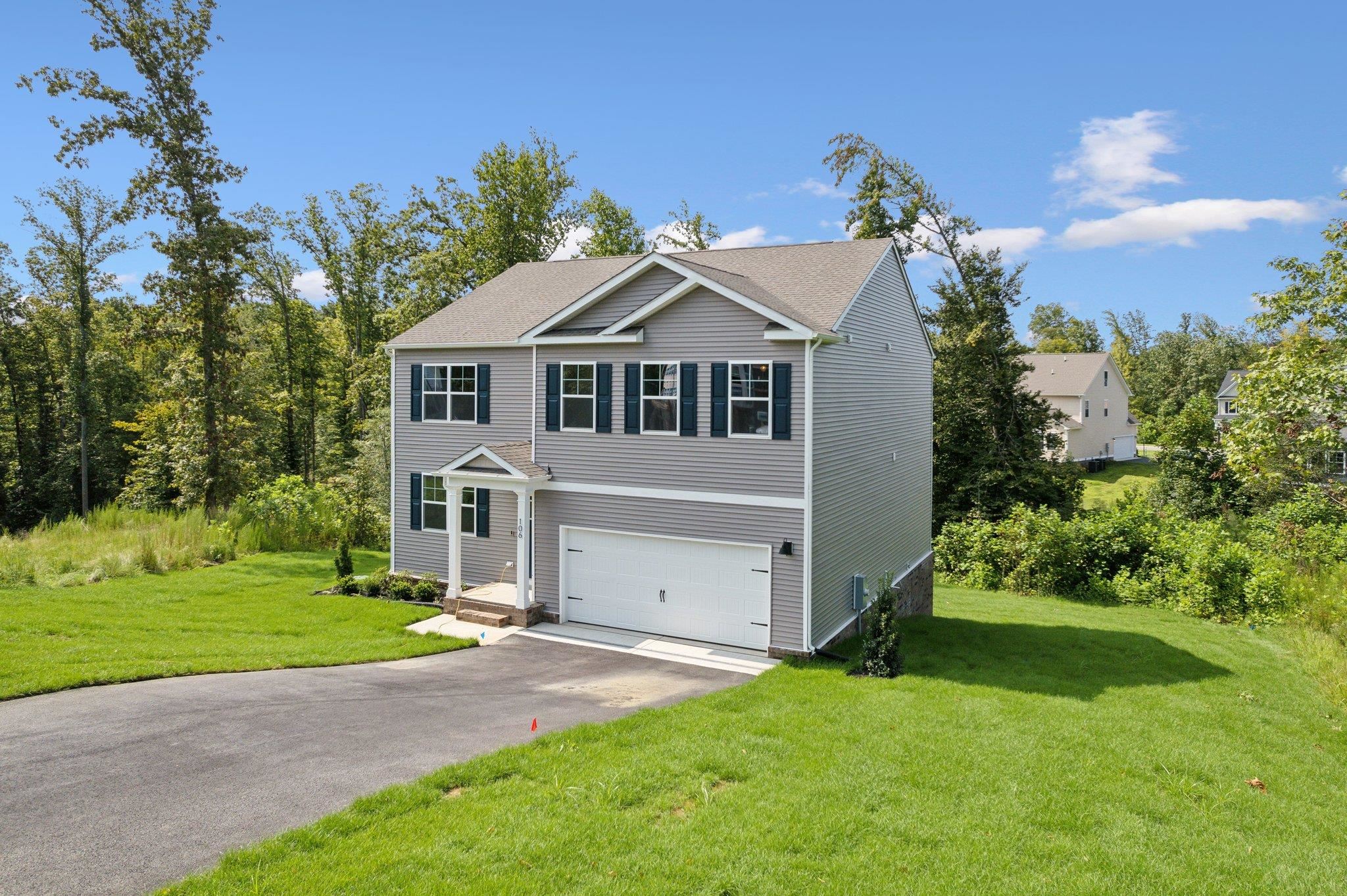 240 Waterfront Drive Raphine, VA 24472 - Photo 3 of 29 a front view of a house with a yard and garage