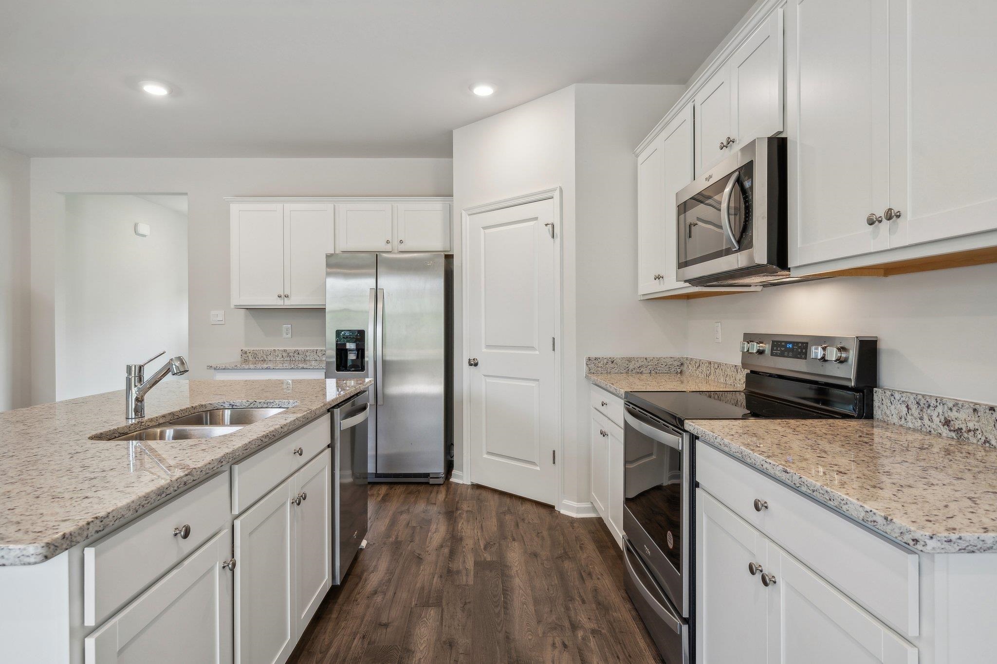 240 Waterfront Drive Raphine, VA 24472 - Photo 6 of 29 a kitchen with stainless steel appliances granite countertop a sink stove and refrigerator