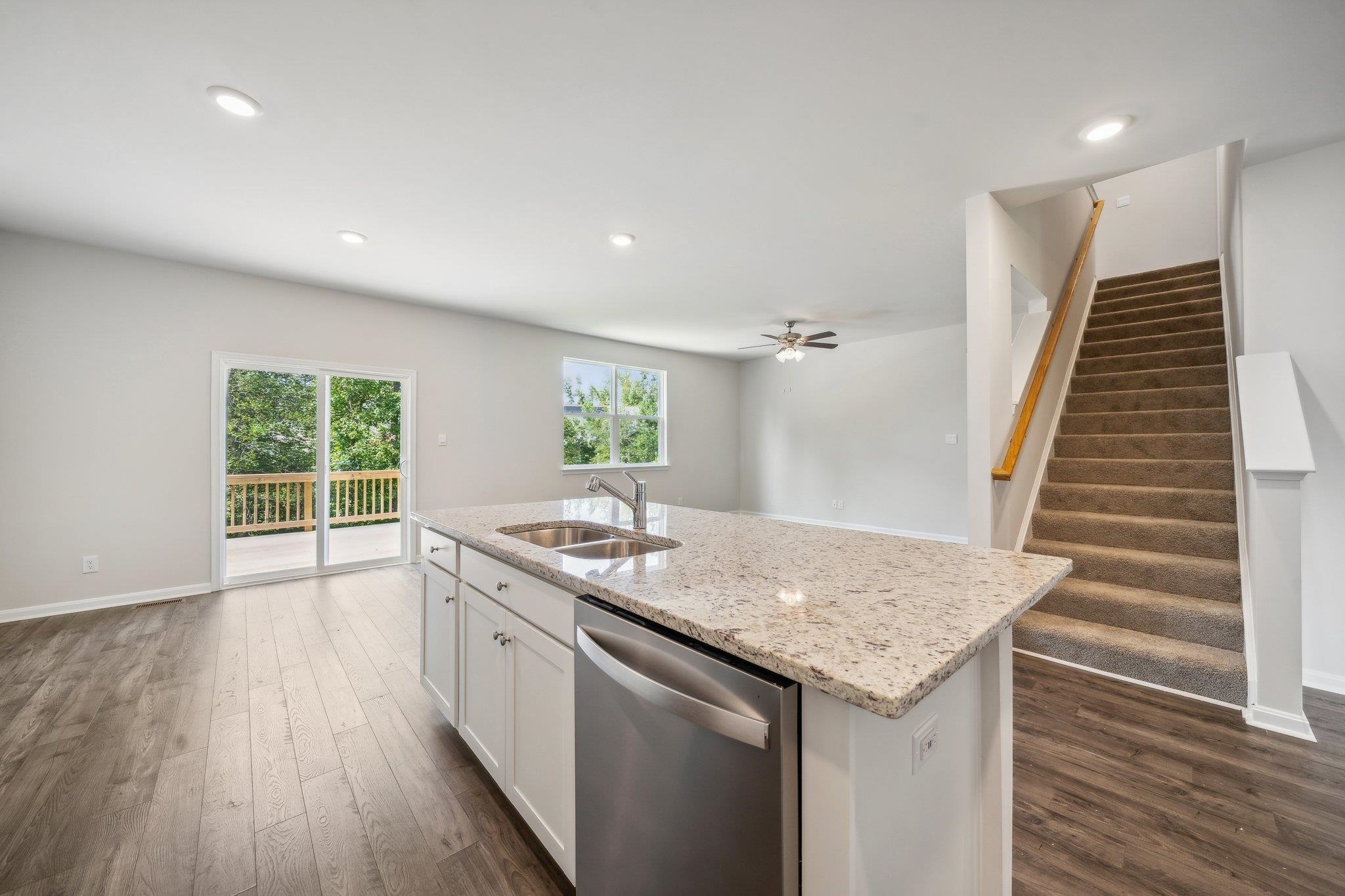 240 Waterfront Drive Raphine, VA 24472 - Photo 7 of 29 a kitchen with a sink and wooden floor