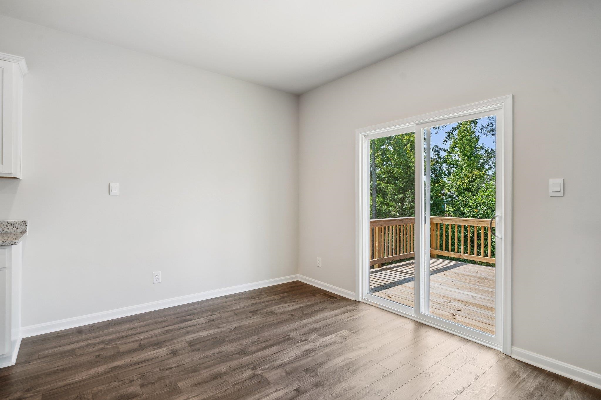 240 Waterfront Drive Raphine, VA 24472 - Photo 8 of 29 an empty room with wooden floor and windows