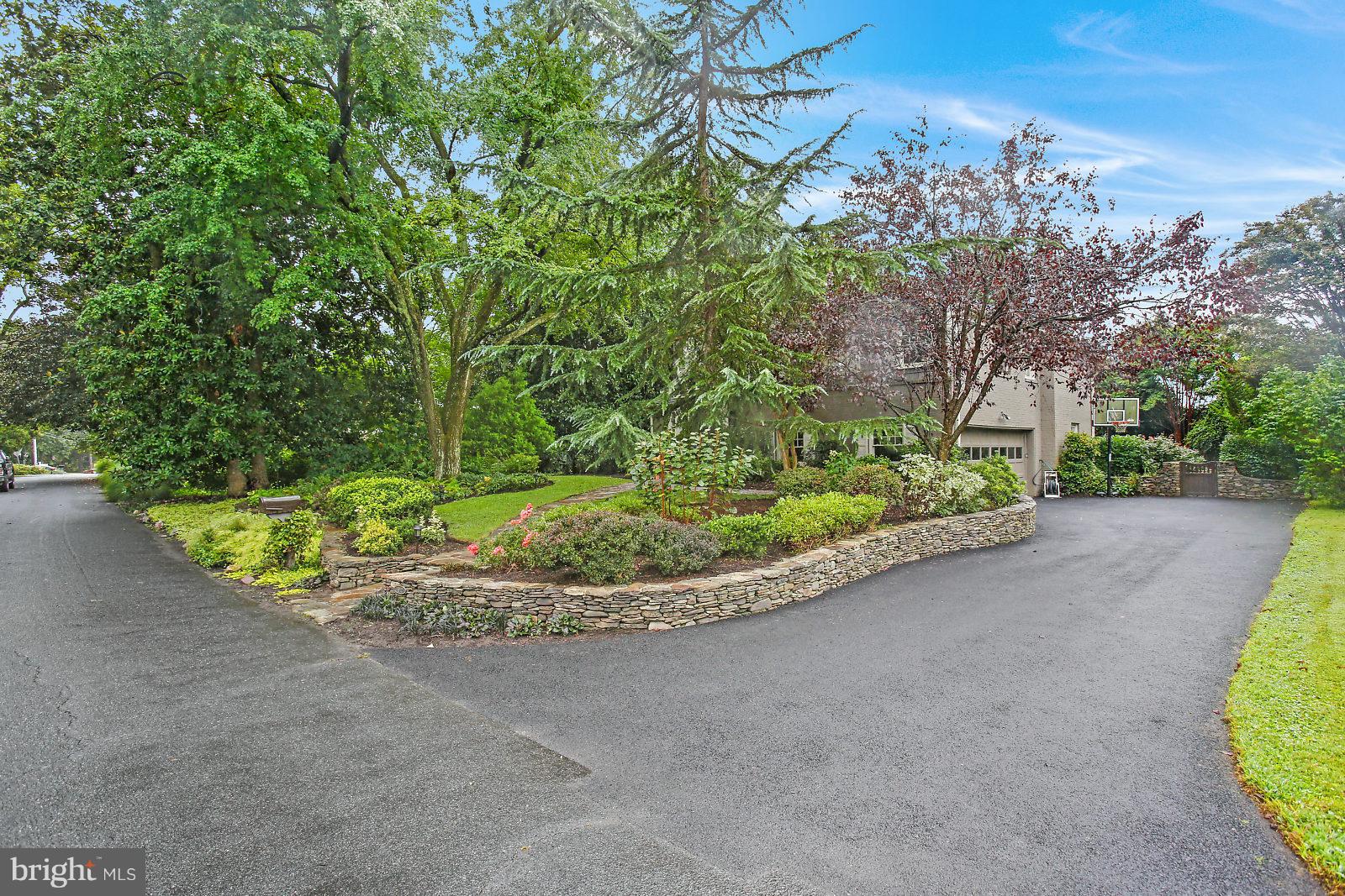1912 Harwood Road Annapolis, MD 21409 - Photo 32 of 37 Custom stone wall partially frames driveway