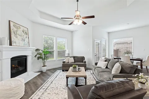 a living room with furniture fireplace and window