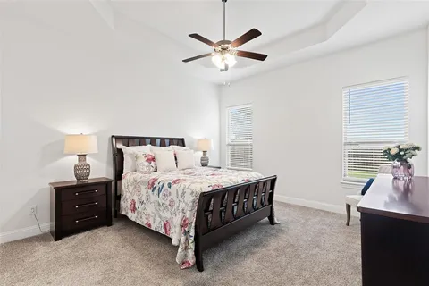a bedroom with a bed and window